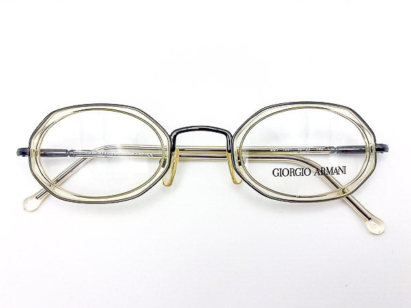 1990s octagonal eyeglasses with clear grey frame and 'Giorgio Armani' logo on a white background