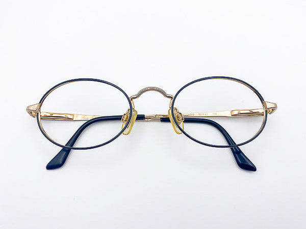 1990s Brooks Brothers round eyeglasses with black frame and gold arms on a white background