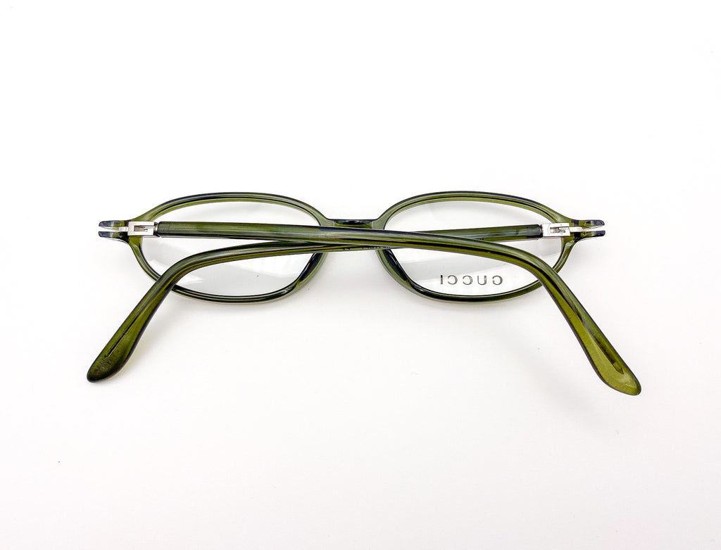 Green eyeglasses on a white background