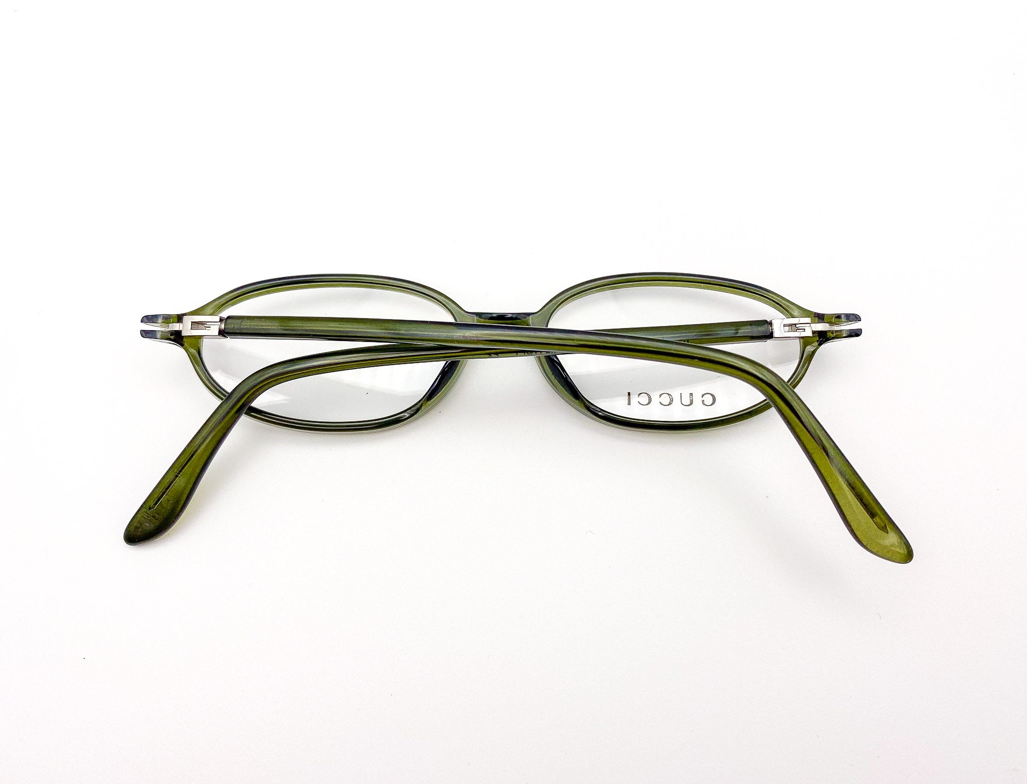 Green eyeglasses on a white background