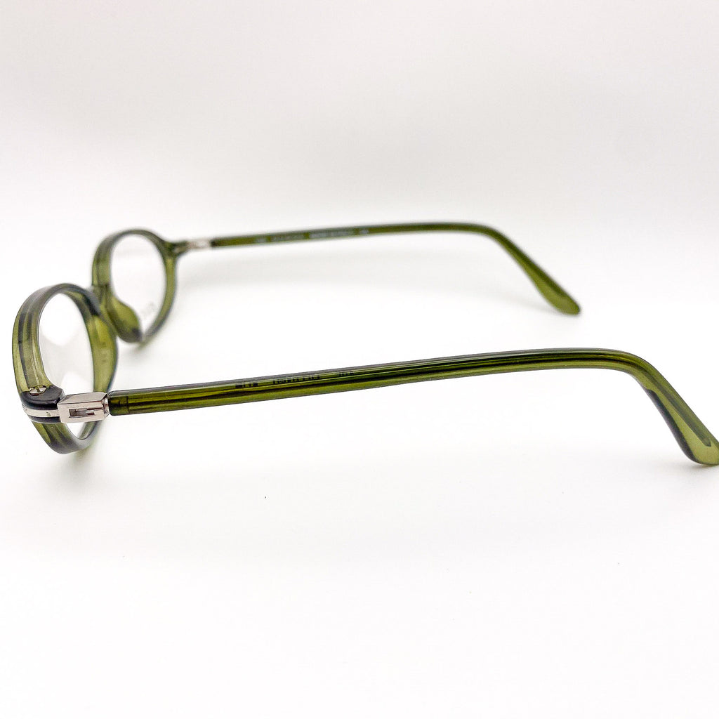 Green eyeglasses on a white background