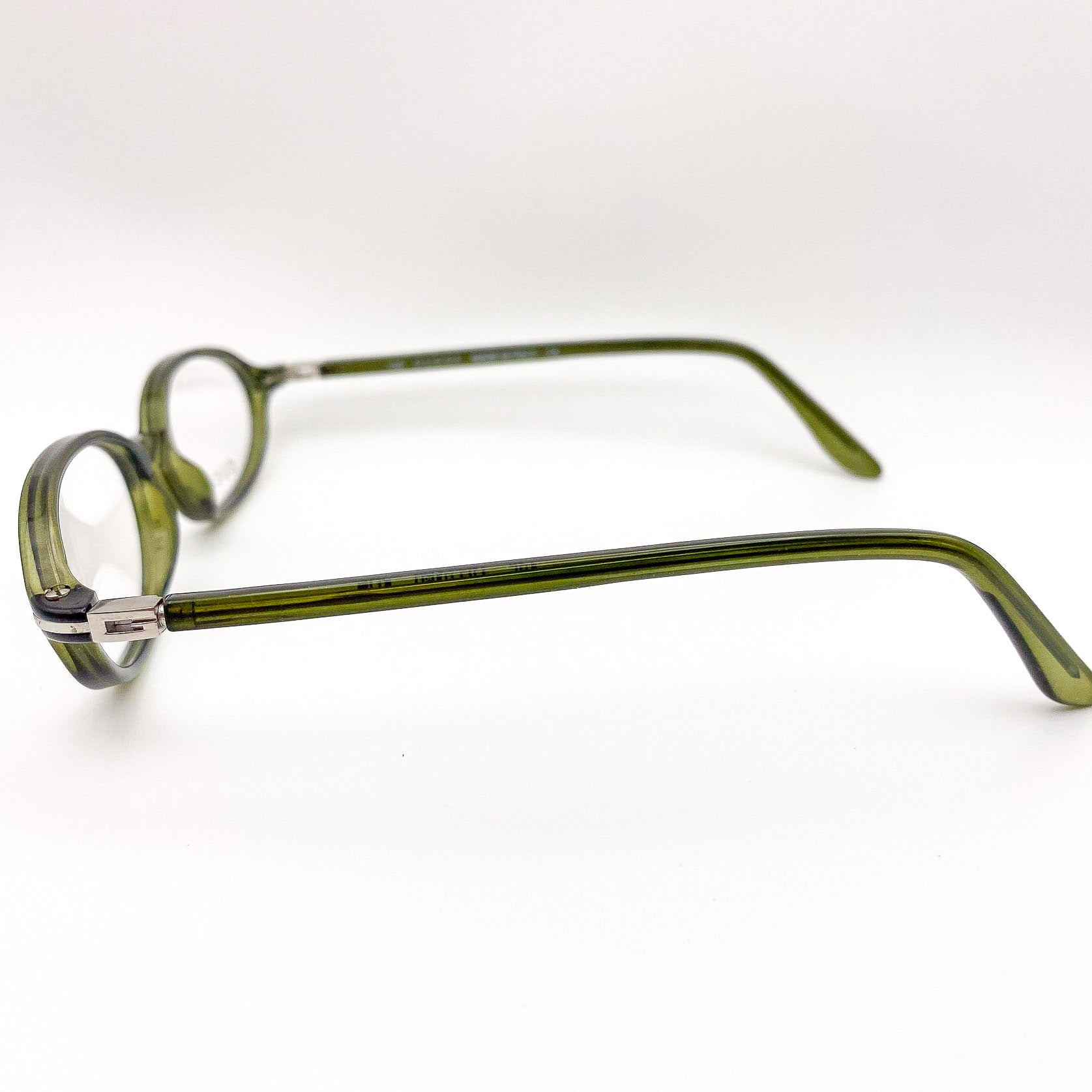 Green eyeglasses on a white background