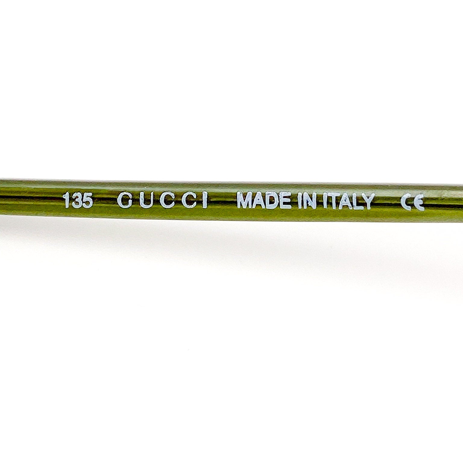 Gucci temple arm with 'Made in Italy' text on a white background