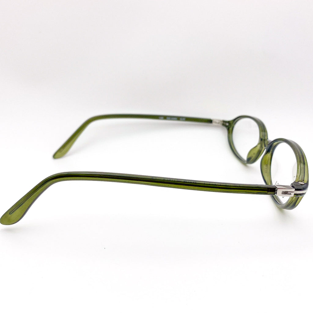 Green eyeglasses on a white background