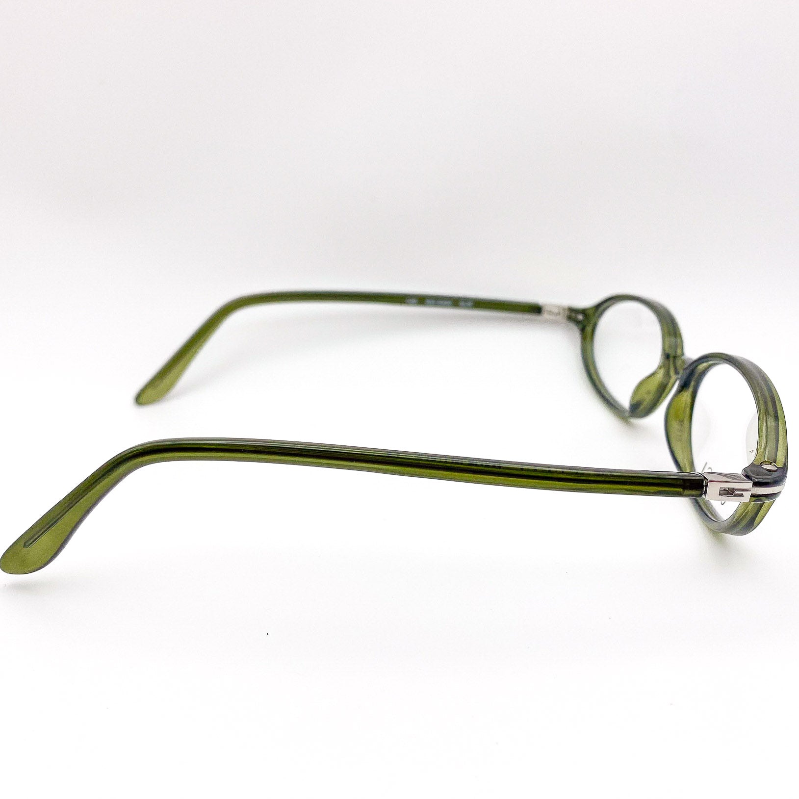 Green eyeglasses on a white background