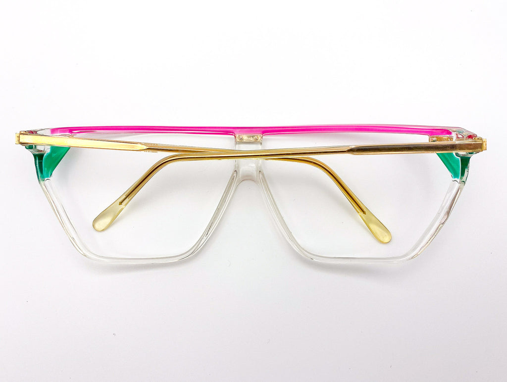 Vintage visor eyeglasses with gold frame, pink top bar, and green sides on a white background