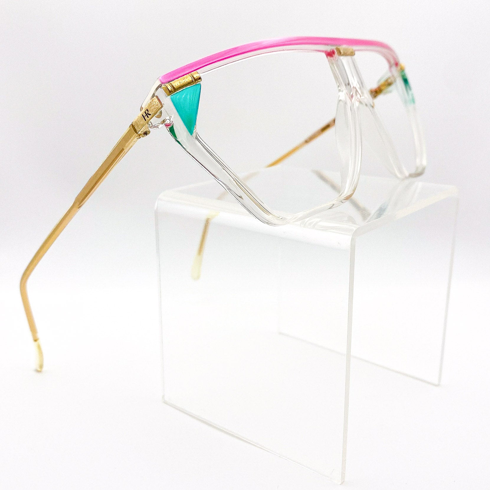 Multicolored eyeglasses on a white background
