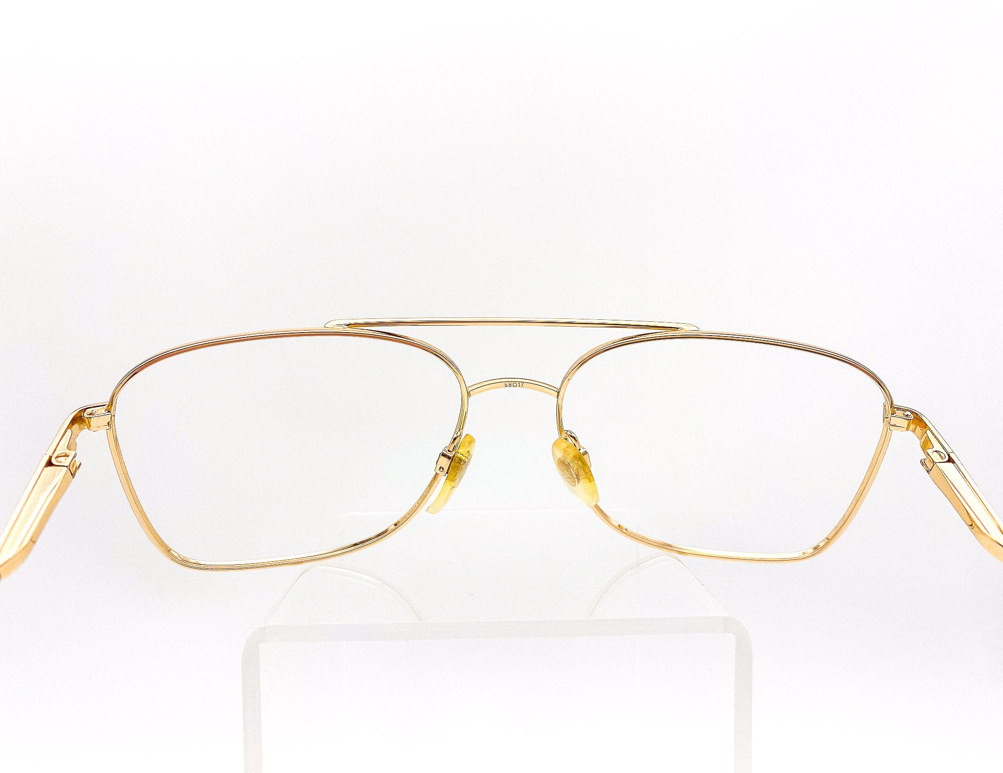 Vintage gold eyeglasses on a white background
