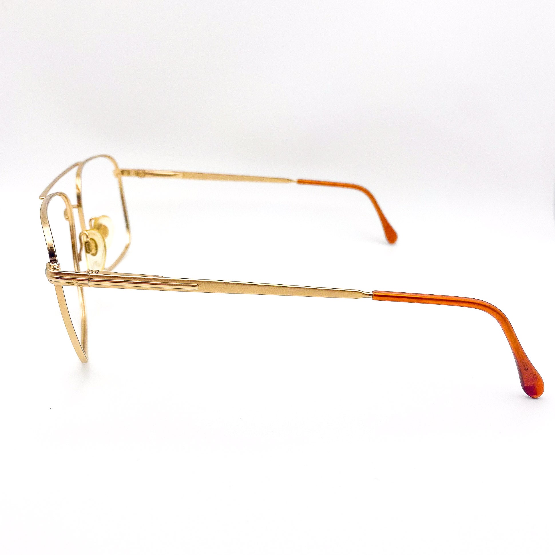 1980s gold-framed aviators on a white background