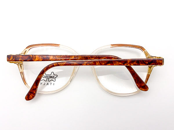 1980s oversized eyeglasses with tortoiseshell frame on a white background