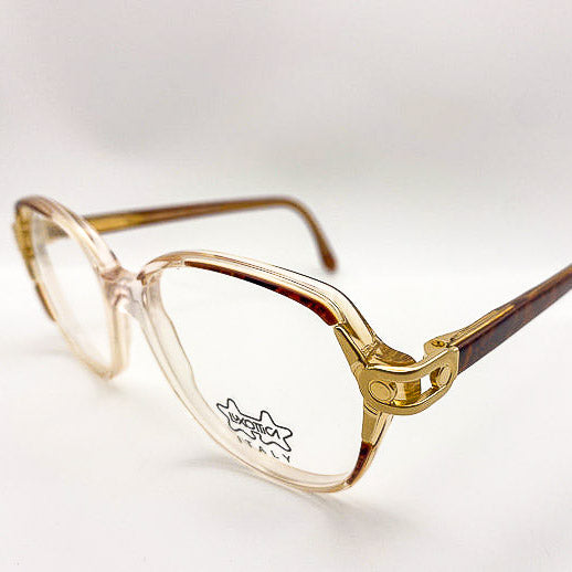Clear glasses with gold accents and tortoiseshell arms on a white background