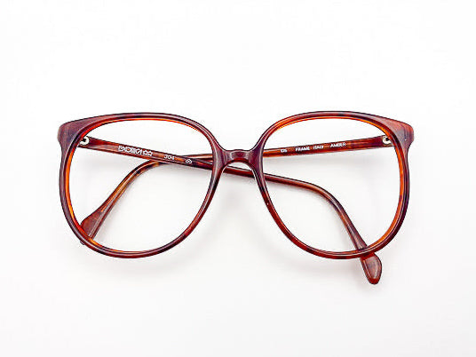 Vintage tortoiseshell eyeglasses on a white background