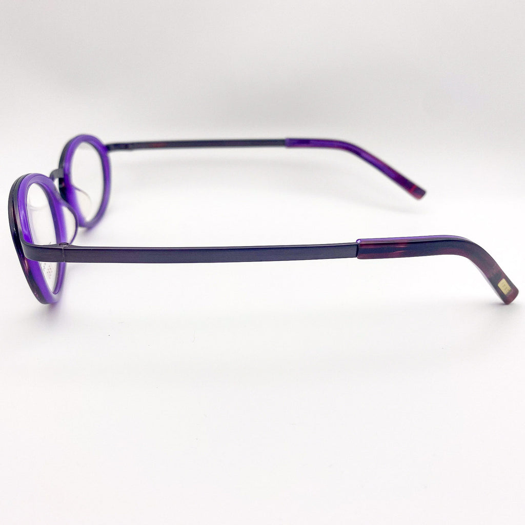 Vintage purple eyeglasses on a white background