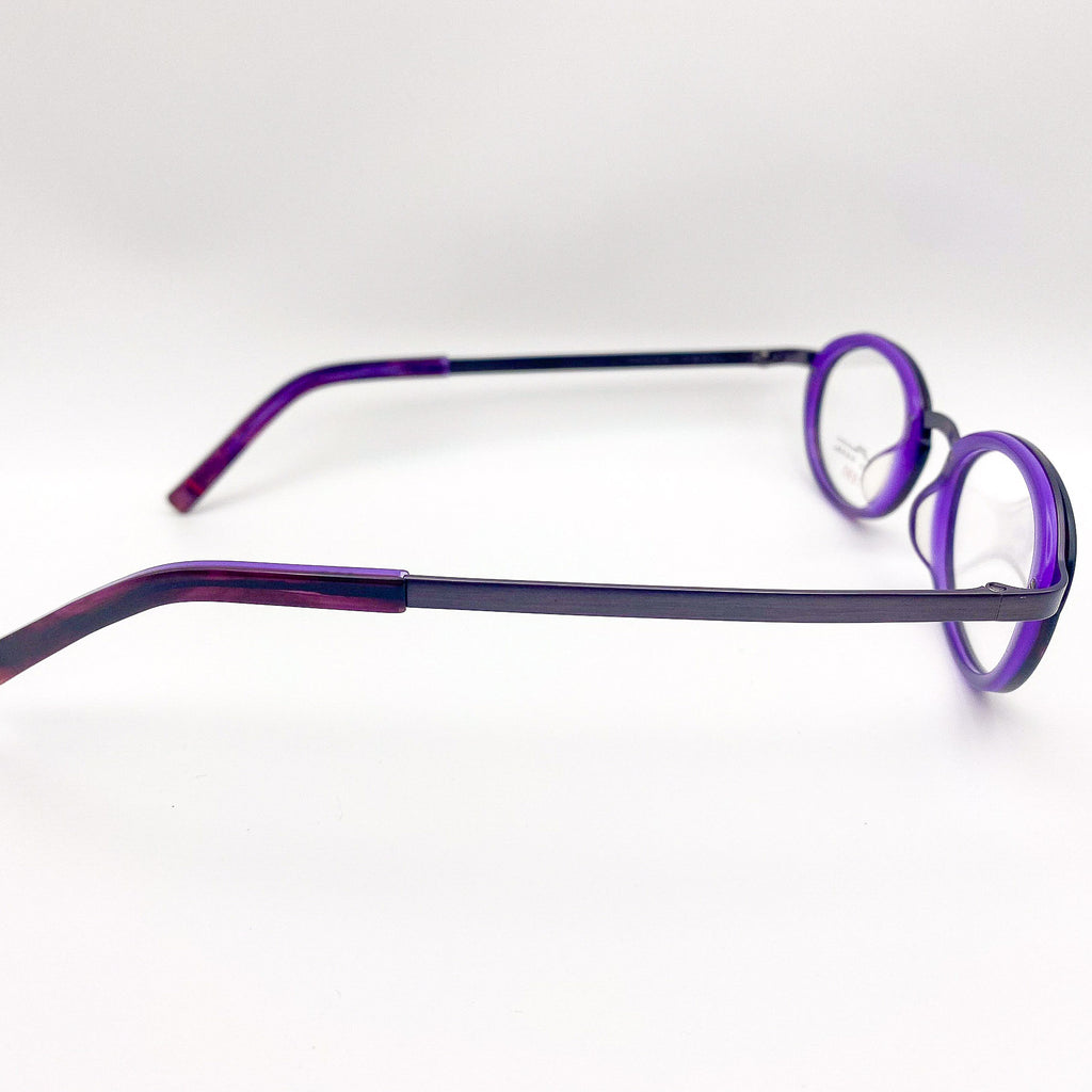 Purple eyeglasses on a white background