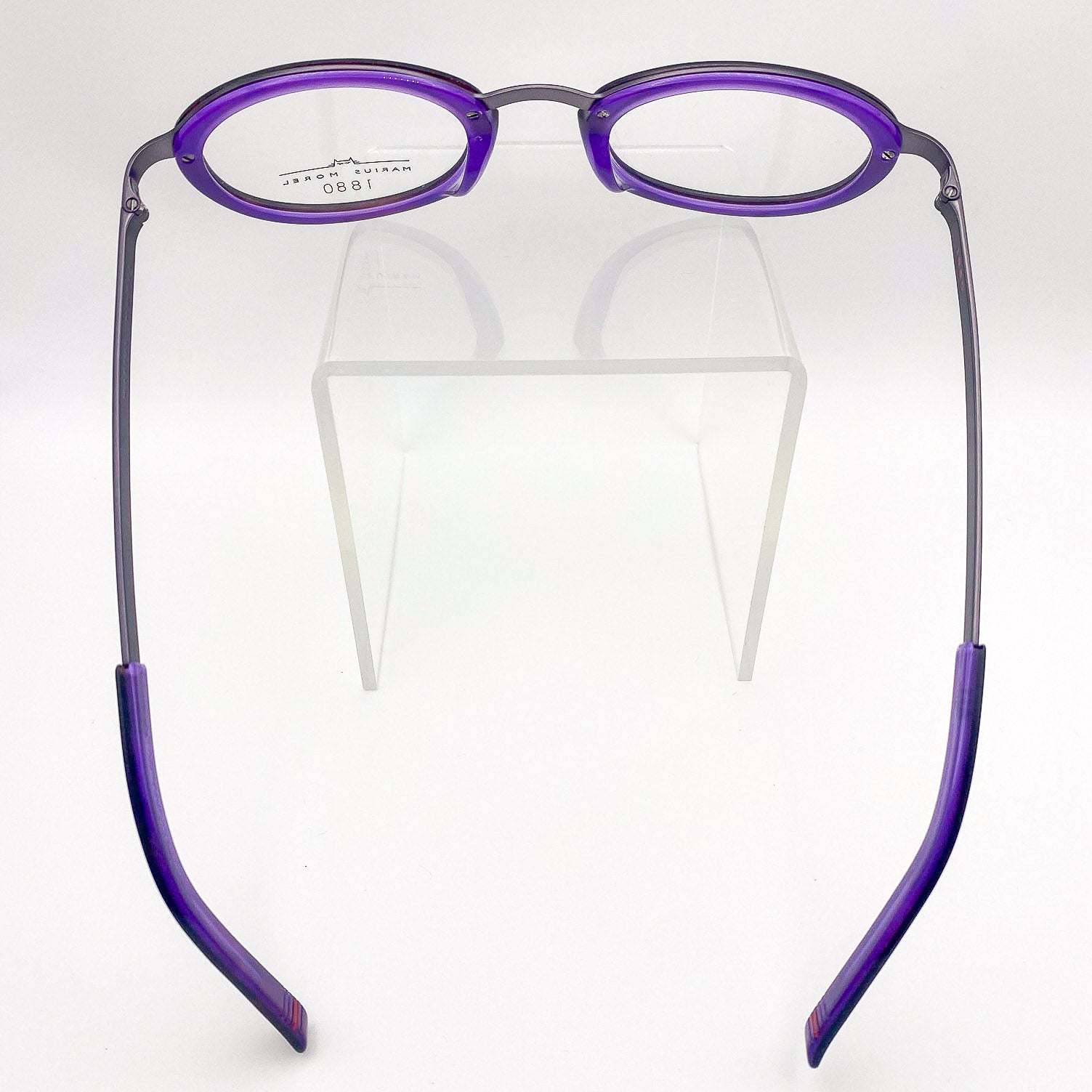 Purple round y2k eyeglasses on a white background
