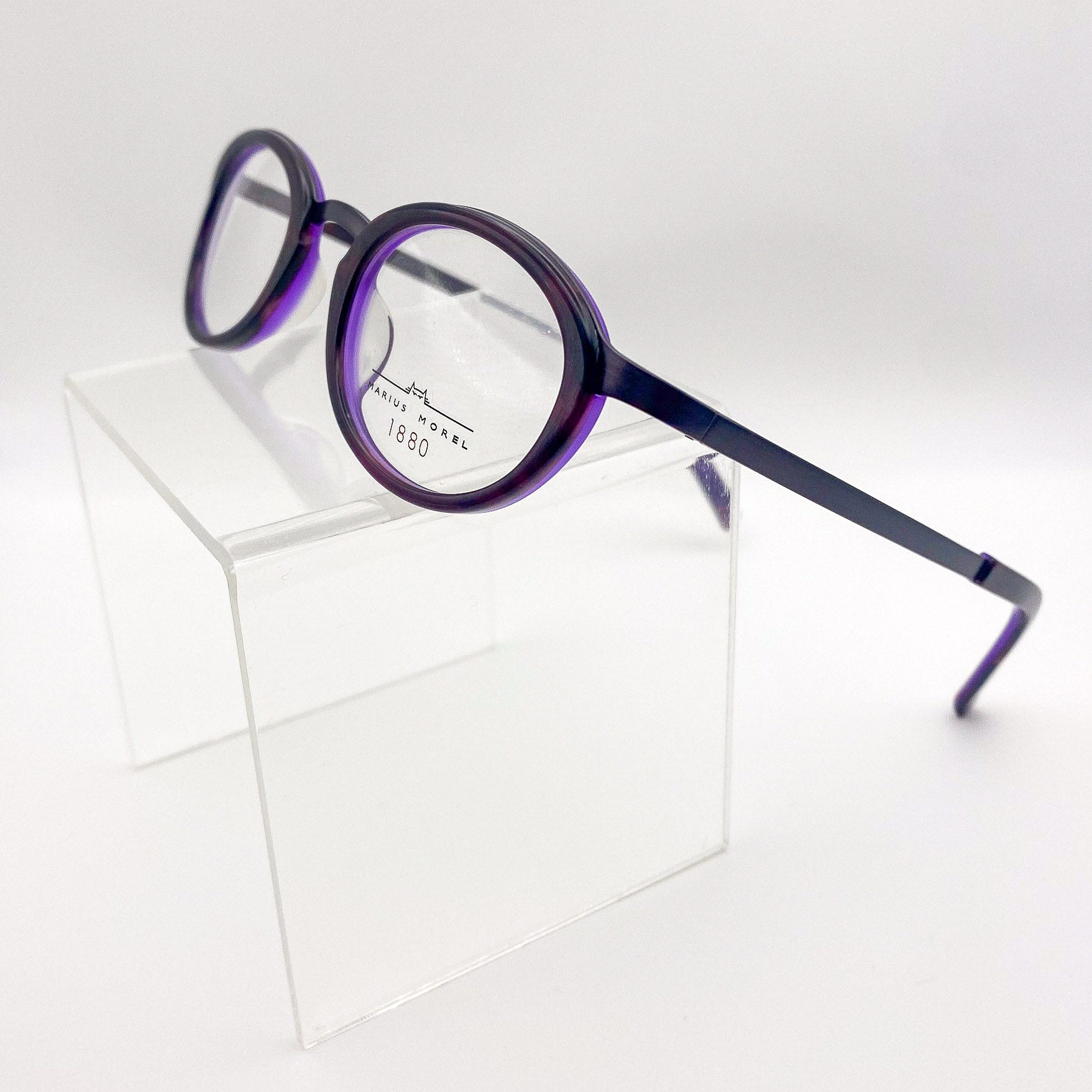Purple eyeglasses on a white background
