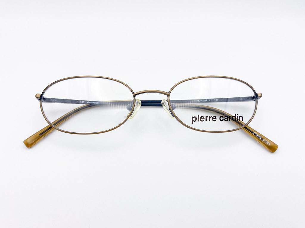 Vintage oval Pierre Cardin eyeglasses on a white background