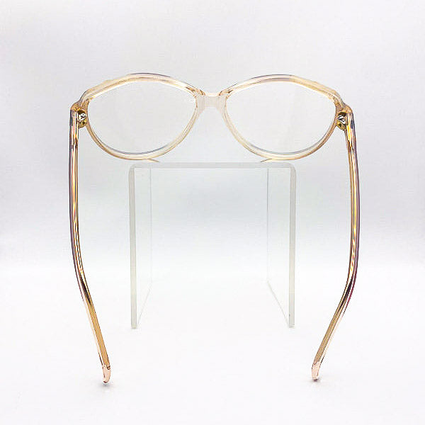 Gold butterfly eyeglass frame on a white background