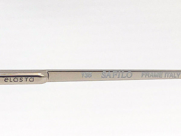 Close-up of a silver frame with 'Safilo' branding on a white background