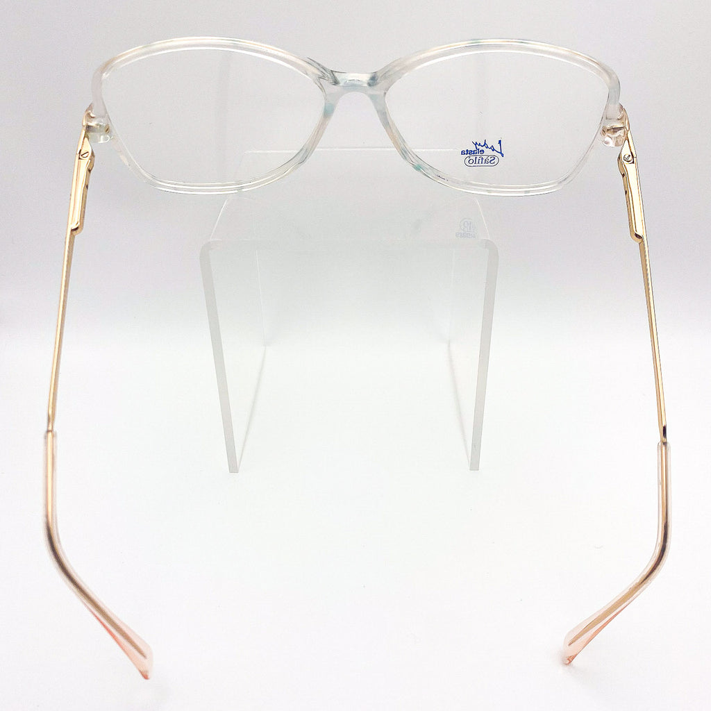 Clear eyeglasses with gold frames on a white background