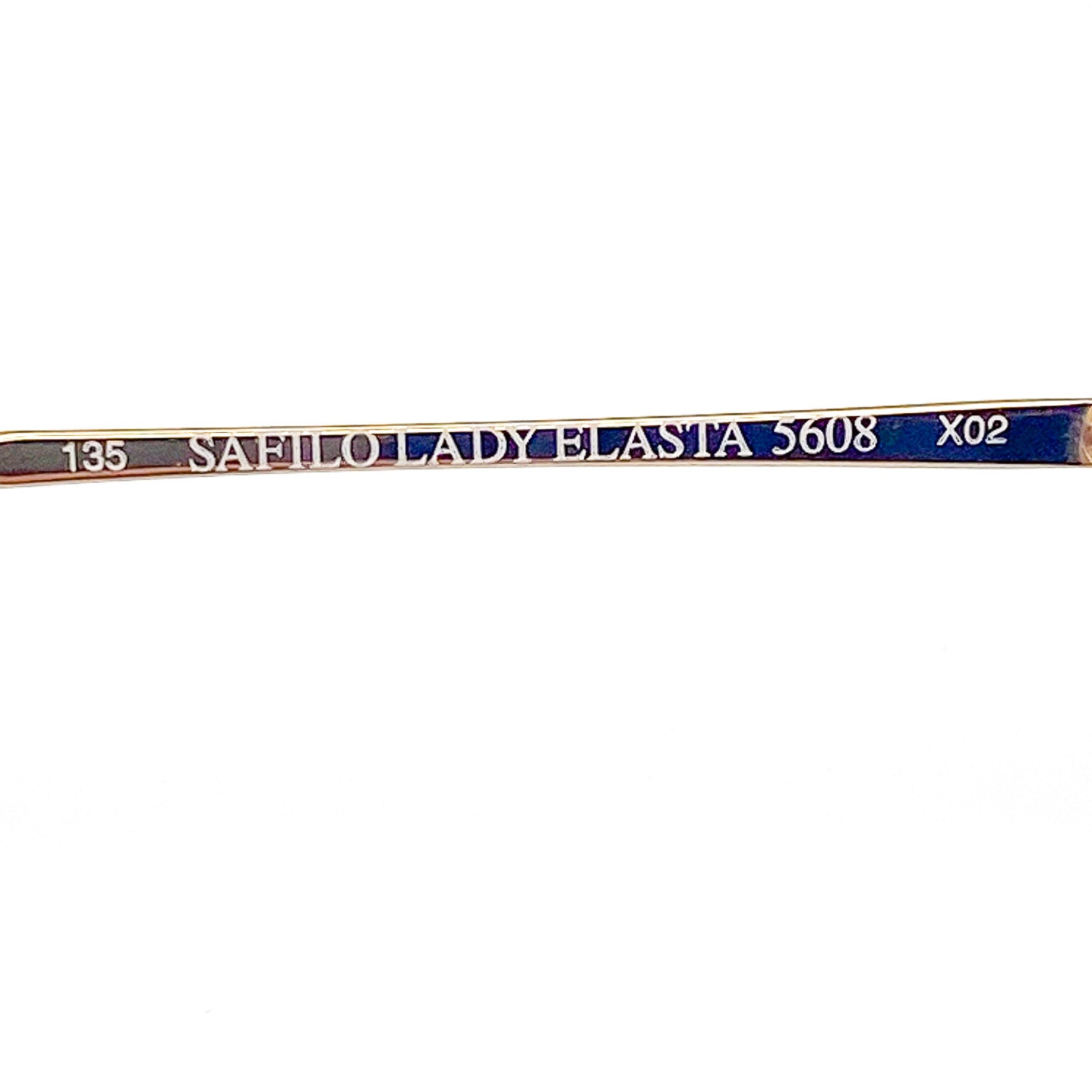 Gold eyeglasses with brand and model details on a white background