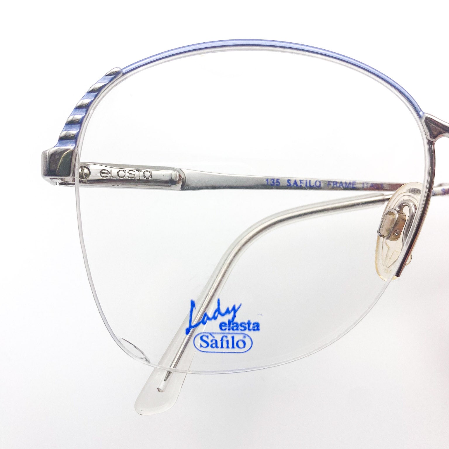 Eyeglasses with 'Safilo' branding on a white background