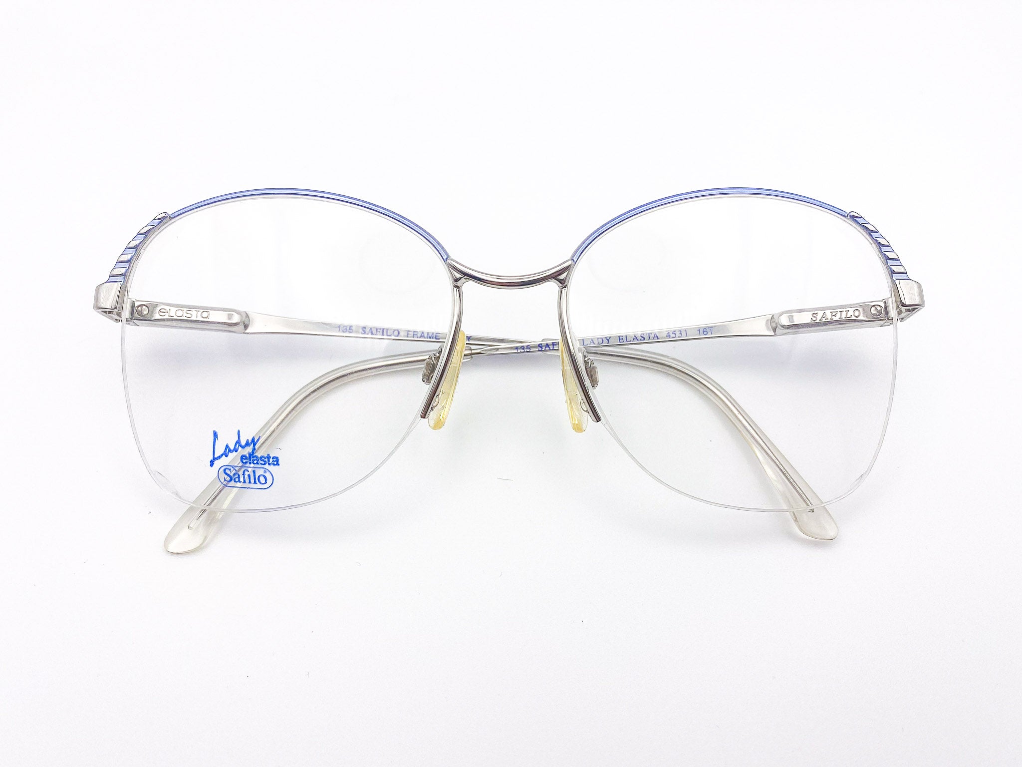 Vintage Safilo silver and blue oversized eyeglasses with a clear background