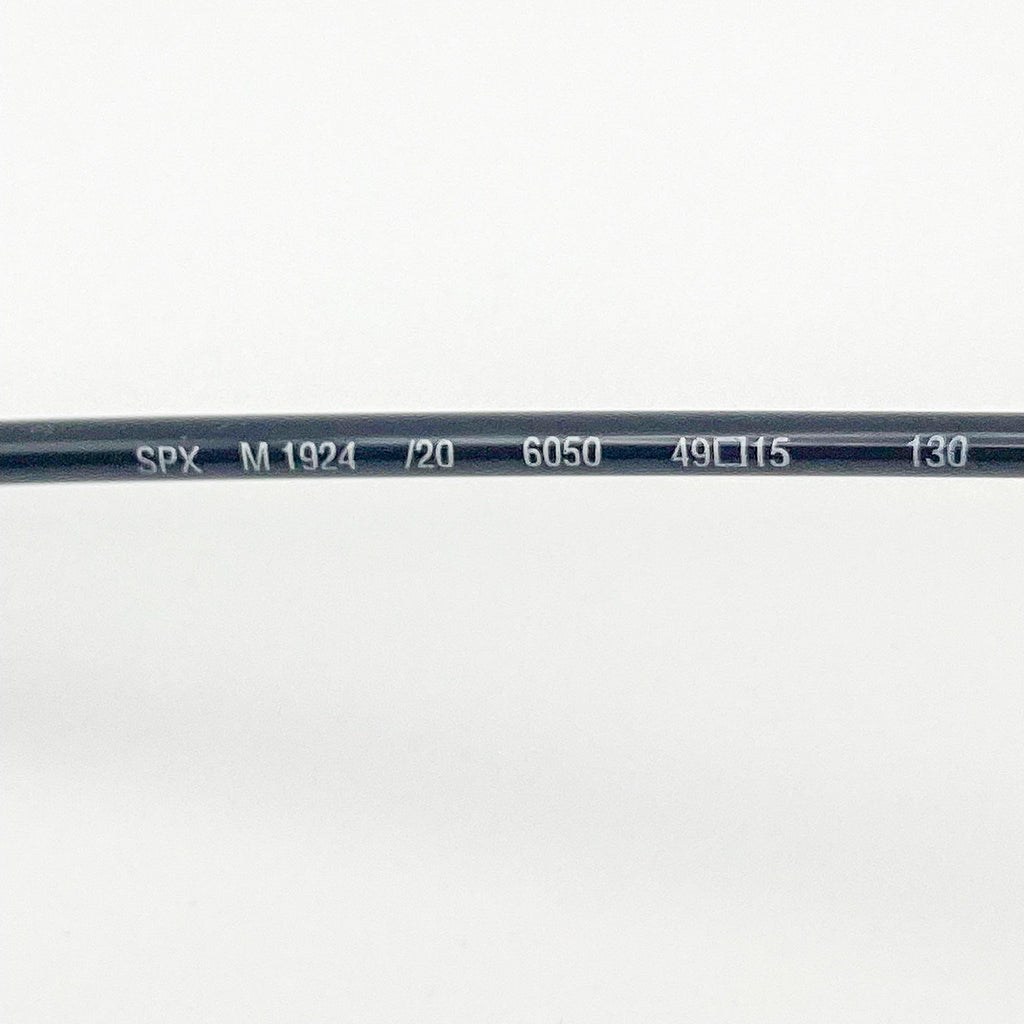 Close-up of a black temple arm with text on a white background