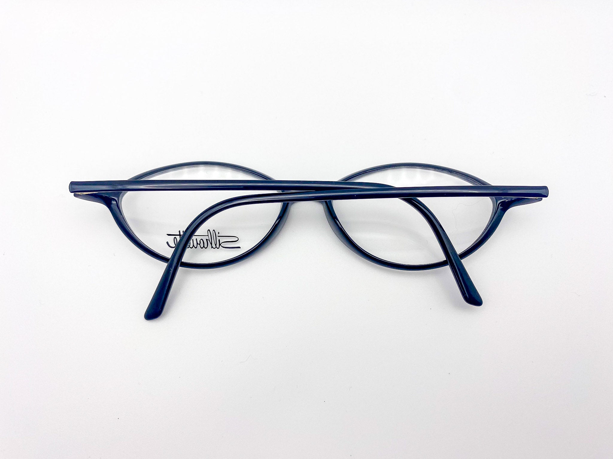 1980s black oval  eyeglasses on a white background