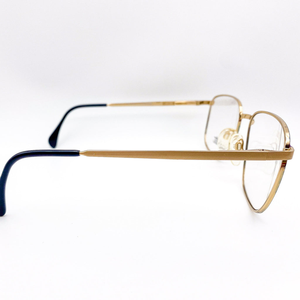 gold eyeglasses frame on a white background
