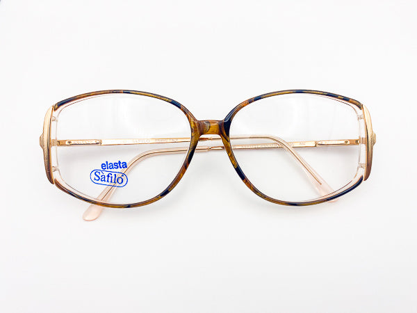 Vintage Safilo eyeglasses with a tortoiseshell frame on a white background