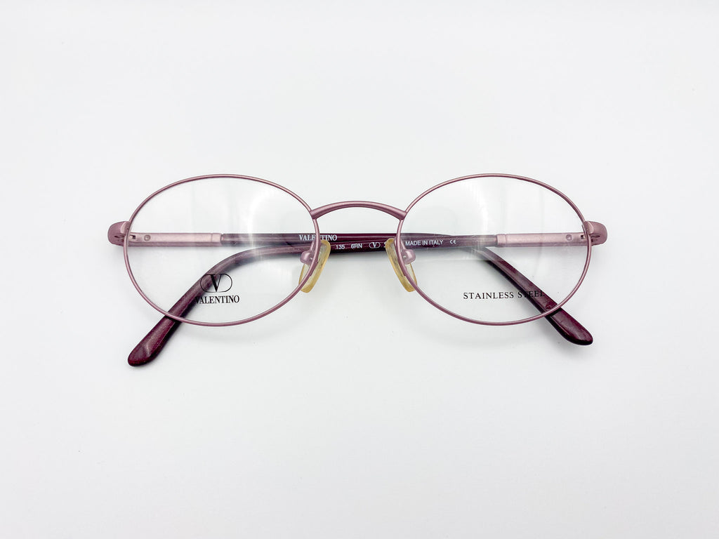 Pair of round eyeglasses with 'Valentino' branding on a white background