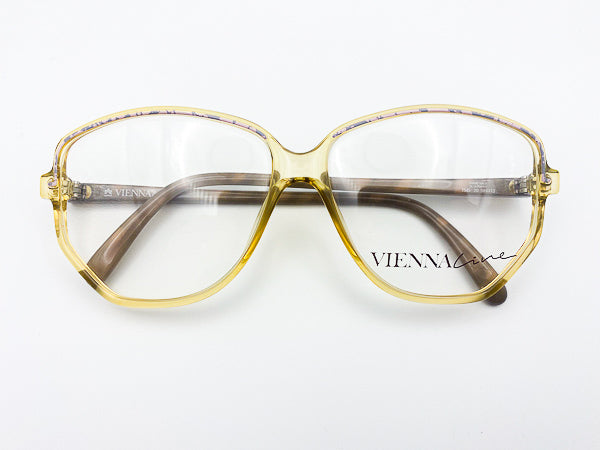 Vintage Vienna Line eyeglasses with yellow green frame on a white background