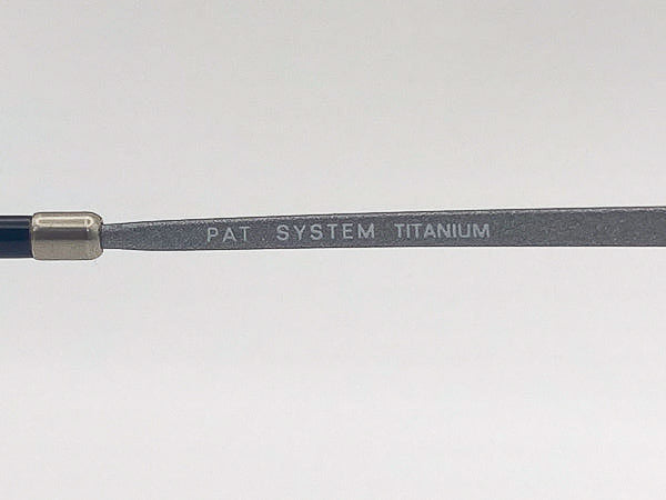 Close-up of a titanium glasses frame with 'PAT SYSTEM TITANIUM' engraving on a white background