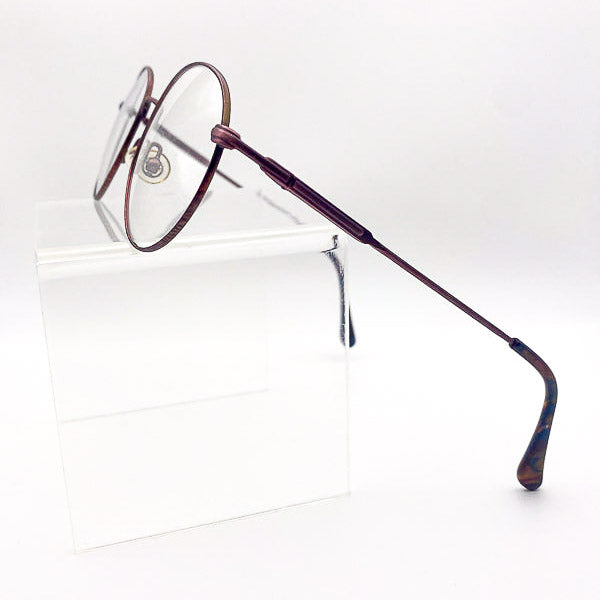 Eyeglasses with a burgundy frame on a white background