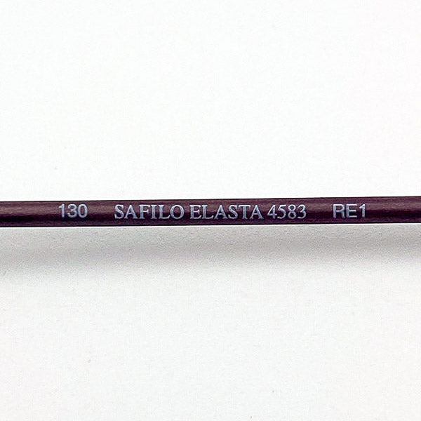 Close-up of a purple eyeglass frame material with 'Safilo Elasta' branding on a white background
