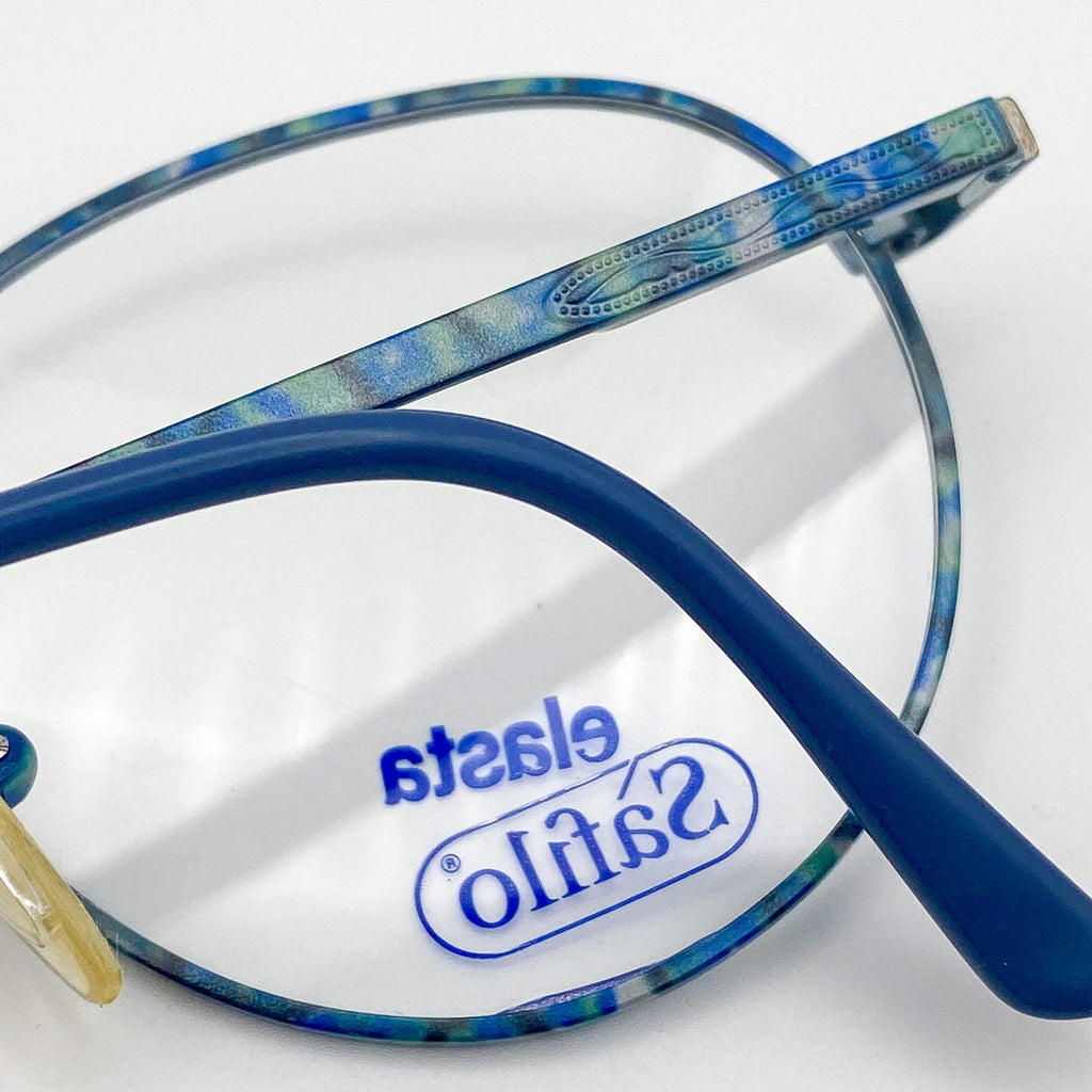 Blue eyeglasses with 'Safilo' branding on a white background