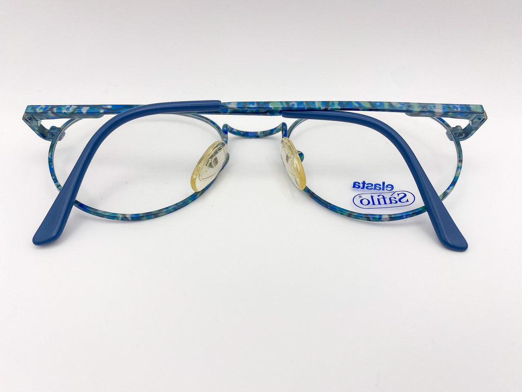 Teal eyeglasses with marbled pattern on a white background