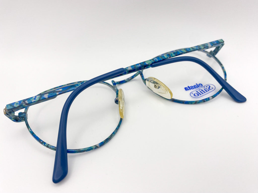 Blue eyeglasses with floral pattern on a white background