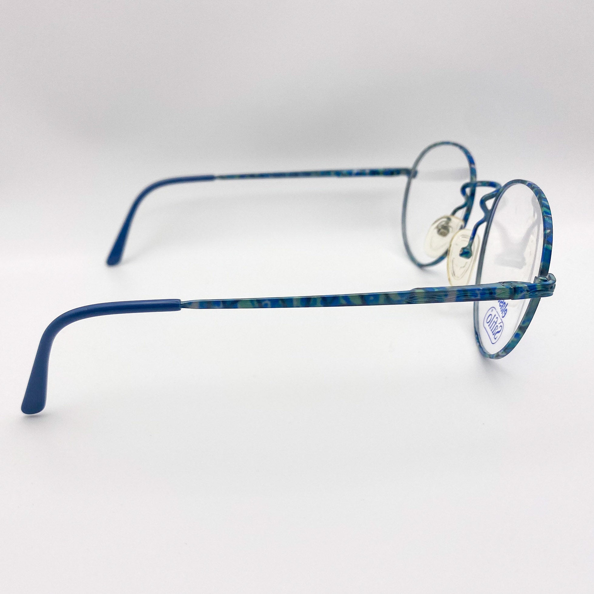 Blue metal eyeglasses on a white background