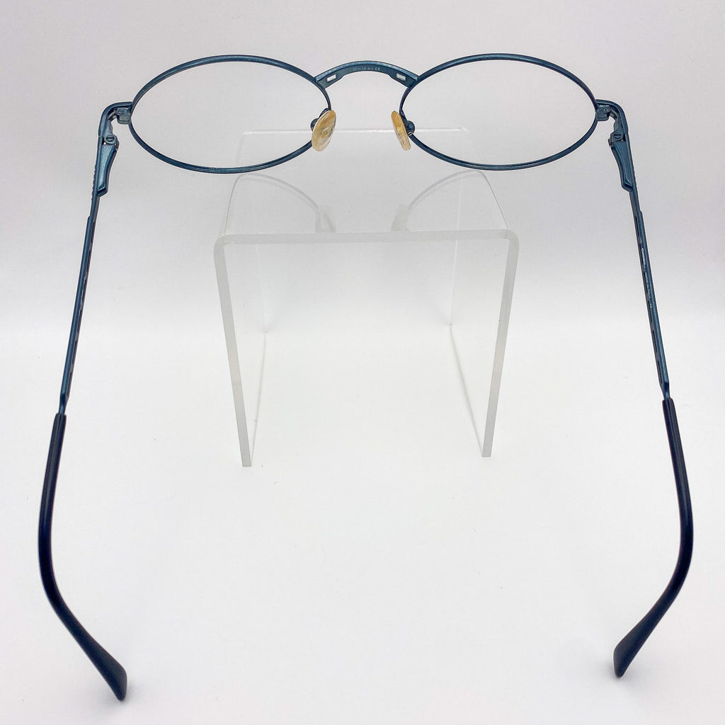 Pair of eyeglasses with blue frames on a white background
