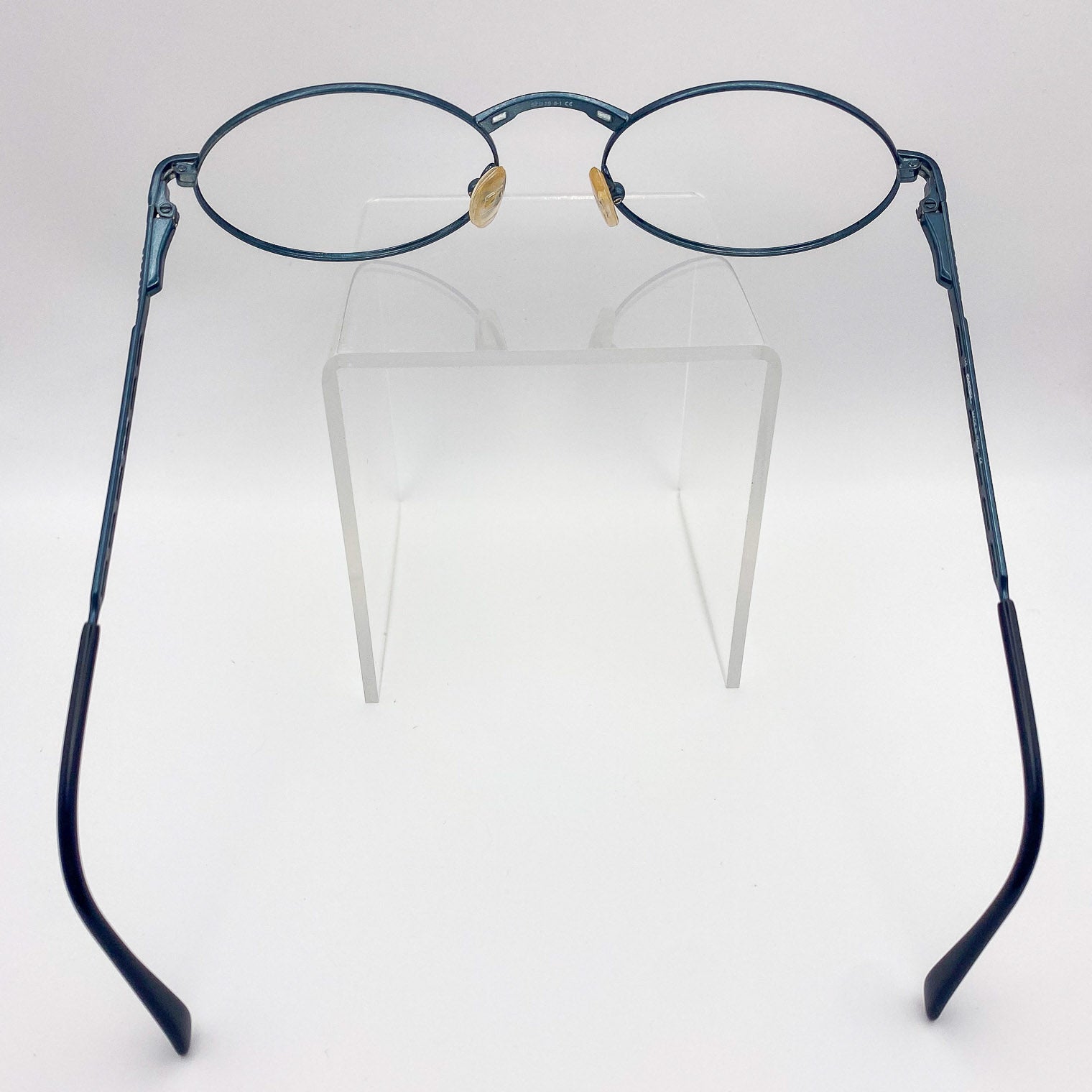 Pair of eyeglasses with blue frames on a white background