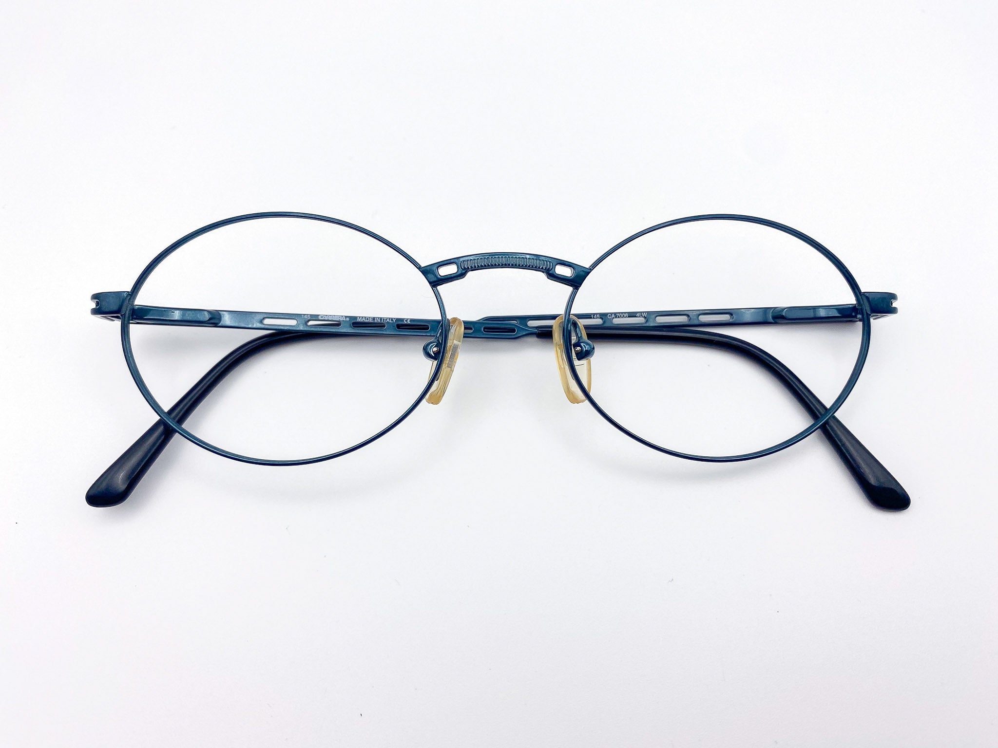 1990s round metal eyeglasses with teal frame on a white background