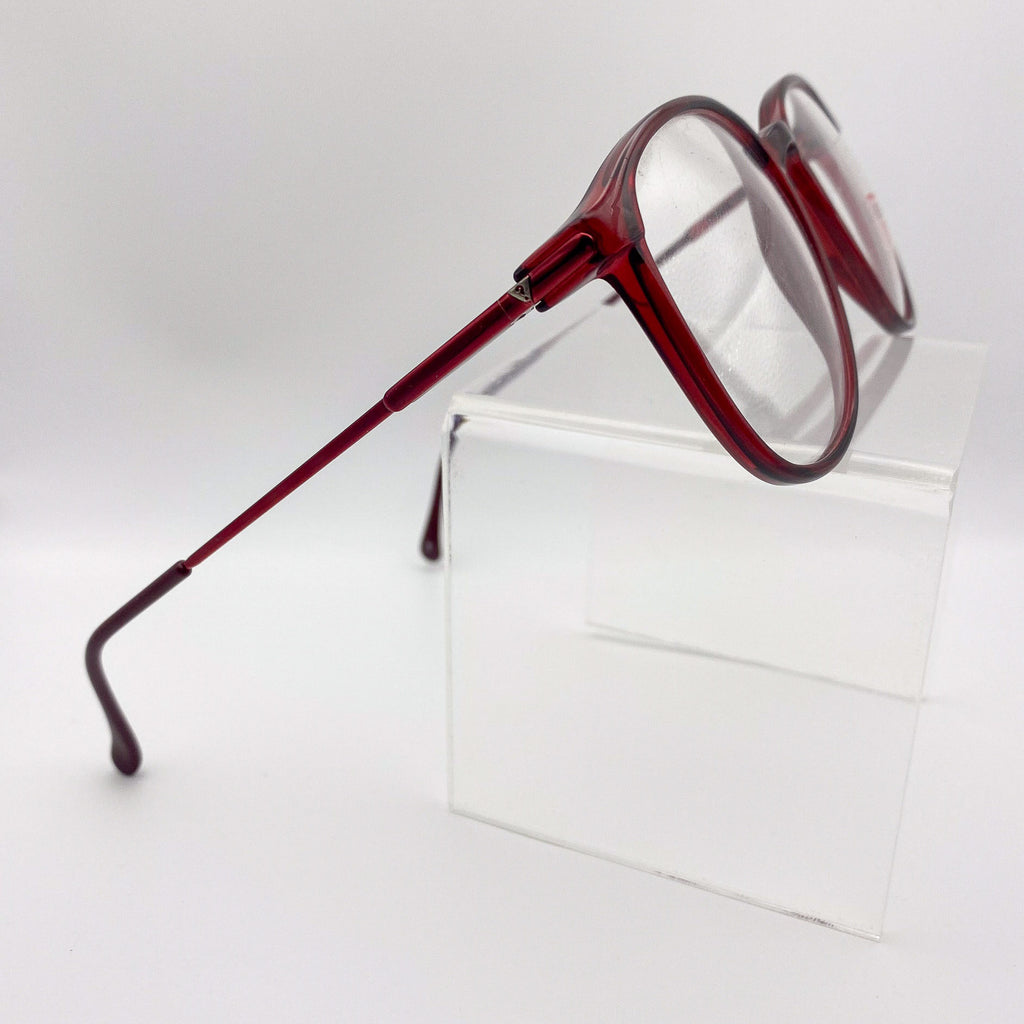 Red eyeglasses on a white background