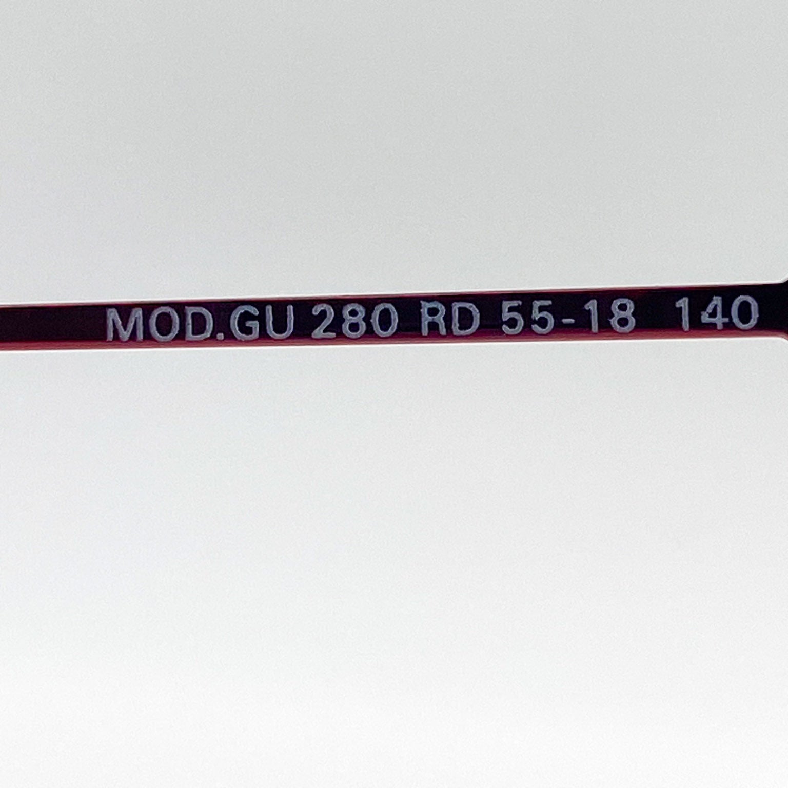 Red eyeglasses stem with text on a white background