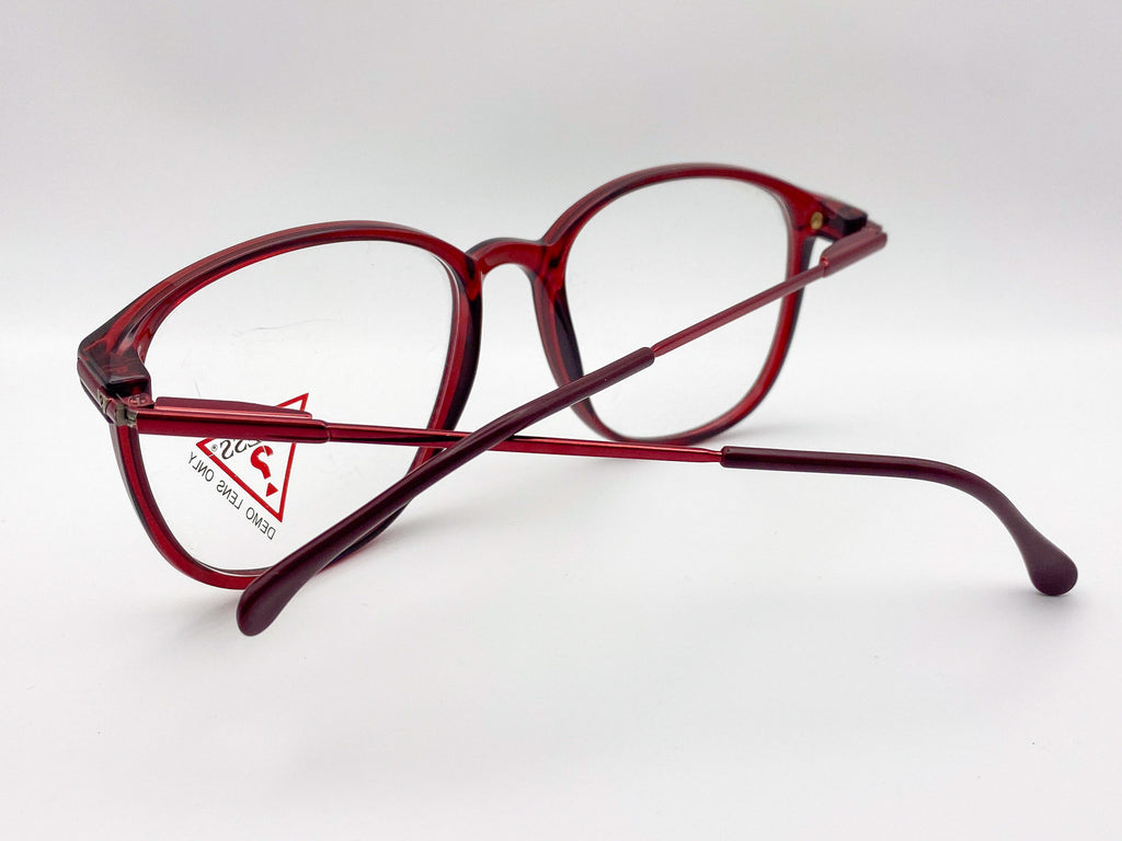 Red eyeglasses on a white background with a visible brand logo.
