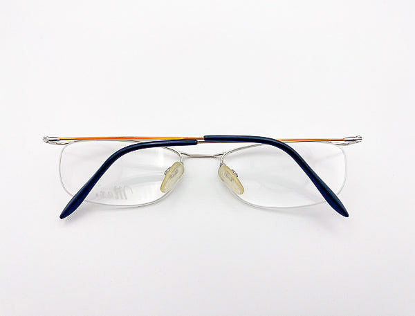 Pair of vintage eyeglasses with black frame on a white background