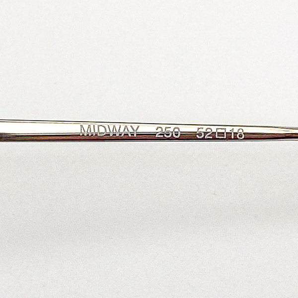 Close-up of an eyeglass frame with 'MIDWAY' branding on a white background