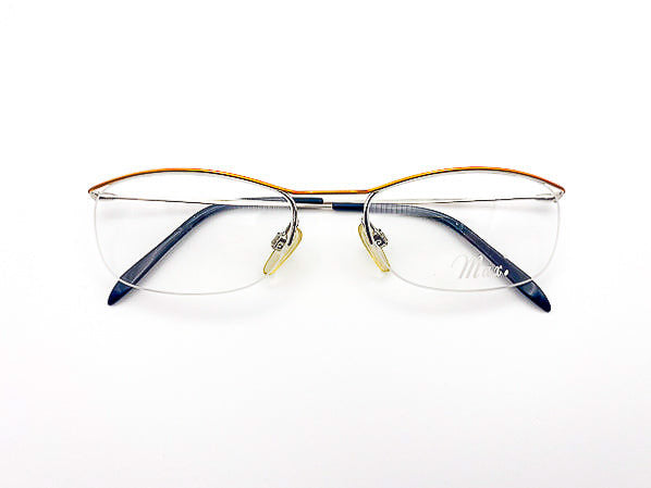1990s Siegel eyeglasses with gold and silver frame on a white background