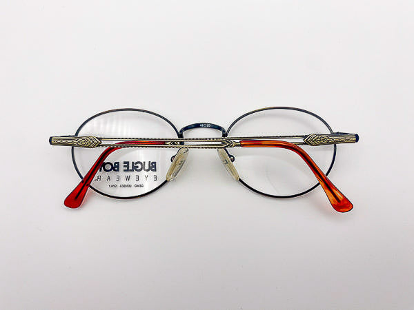 1990s round eyeglasses with tortoise and antique gold frame on a white background